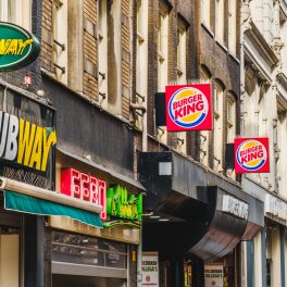 Amsterdam, Netherlands - march 2018: Fastfood chain brand logos of Subway, Mcdonald and Burger King in City center of Amsterdam